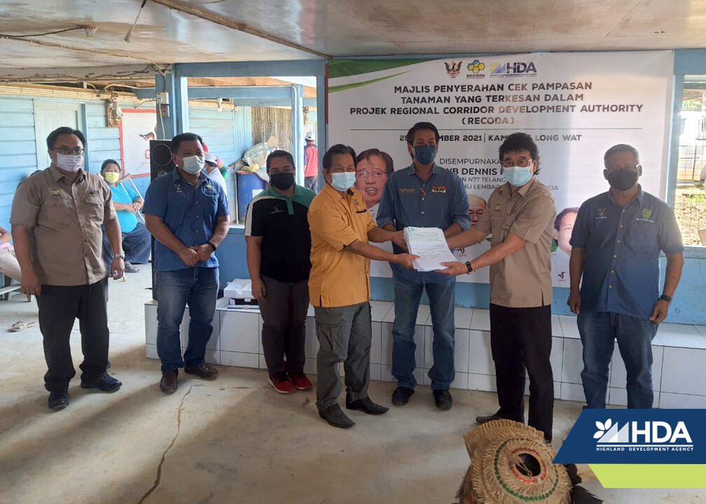 HDA hands out compensation cheques to community members of Long Wat, Long Atip